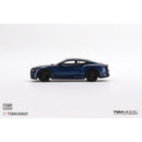 a blue toy car on a white background