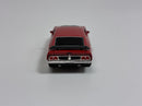 a red toy car on a white background