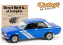 a blue toy car next to a paper