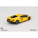 a yellow toy car on a white background