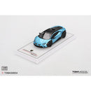 a blue toy car on a white surface