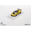 a yellow race car on a white surface