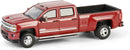 a red pickup truck with a side mirror