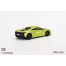 a green toy car on a white background