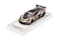 a gold race car on a white rectangular surface