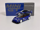 a blue toy car next to a box