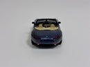 a blue toy car with tan seats