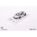 a white toy car on a white surface