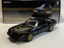 a black toy car with gold rims
