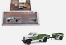 a green and white toy truck with a trailer