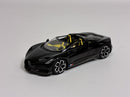 a black toy car on a white background