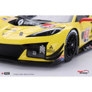 a yellow race car with black wheels