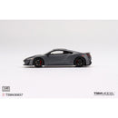a grey sports car on a white background