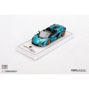 a blue toy car on a white surface