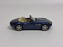 a blue toy car with tan top