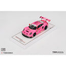 a pink toy car on a white surface