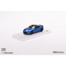 a blue toy car on a white surface