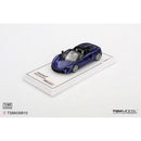 a blue toy car on a white stand