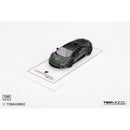 a toy car on a white surface