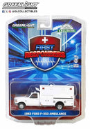 a white toy ambulance in a package