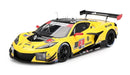 a yellow race car with black and white stripes