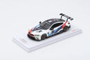 a toy car on a white surface