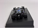 a toy race car on a black surface
