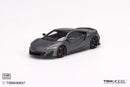 a grey sports car on a white background