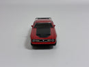 a red toy car on a white background