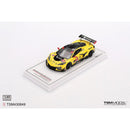a yellow race car on a white surface