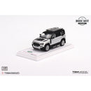 a toy car on a white surface