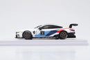 a white race car with a red white and blue stripe on it