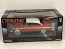a red and white toy car in a box