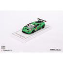 a green toy car on a white surface