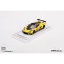 a yellow race car on a white surface