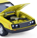 a yellow toy car with the hood open