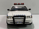 a white police car with blue stripes