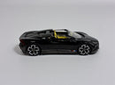 a black toy car with yellow top