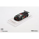 a black toy car on a white surface
