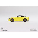 a yellow toy car on a white background