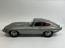 a silver car with red windows