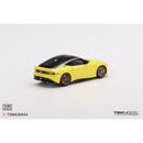 a yellow toy car on a white background