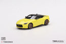 a yellow toy car on a white background