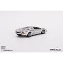 a silver toy car on a white background