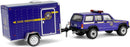 a toy car towing a police car