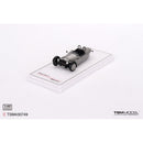 a small grey car on a white surface