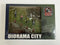 Diorama City Countryside 4 x Figures 2 x Flag 4 x Traffic Cone x 2 Back Drop Card 1:64 64BDOR002